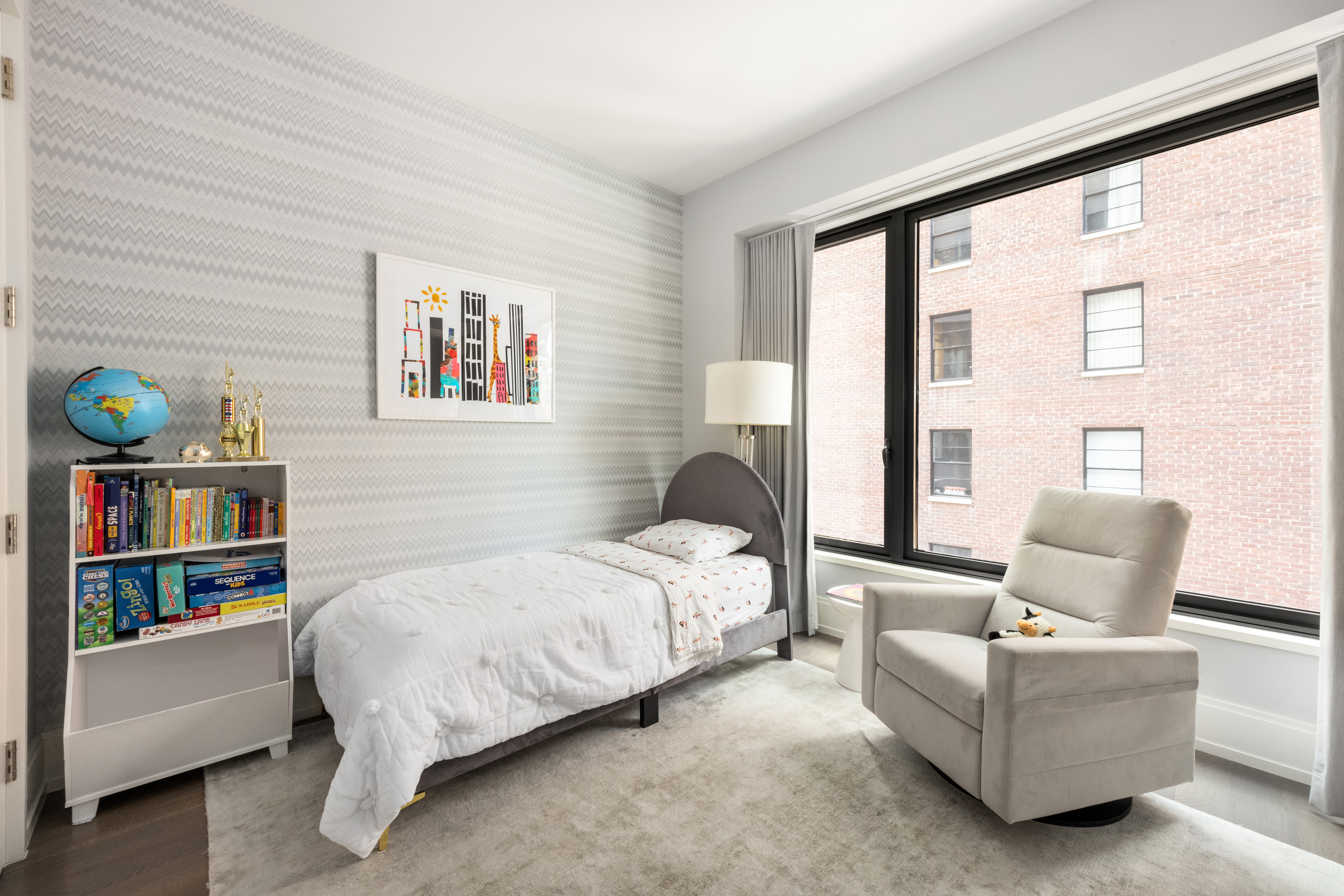 301 East 50th Street, Unit 8C Manhattan, NY 10022 - Photo 8 of 20 a bedroom with a bed couch and a window
