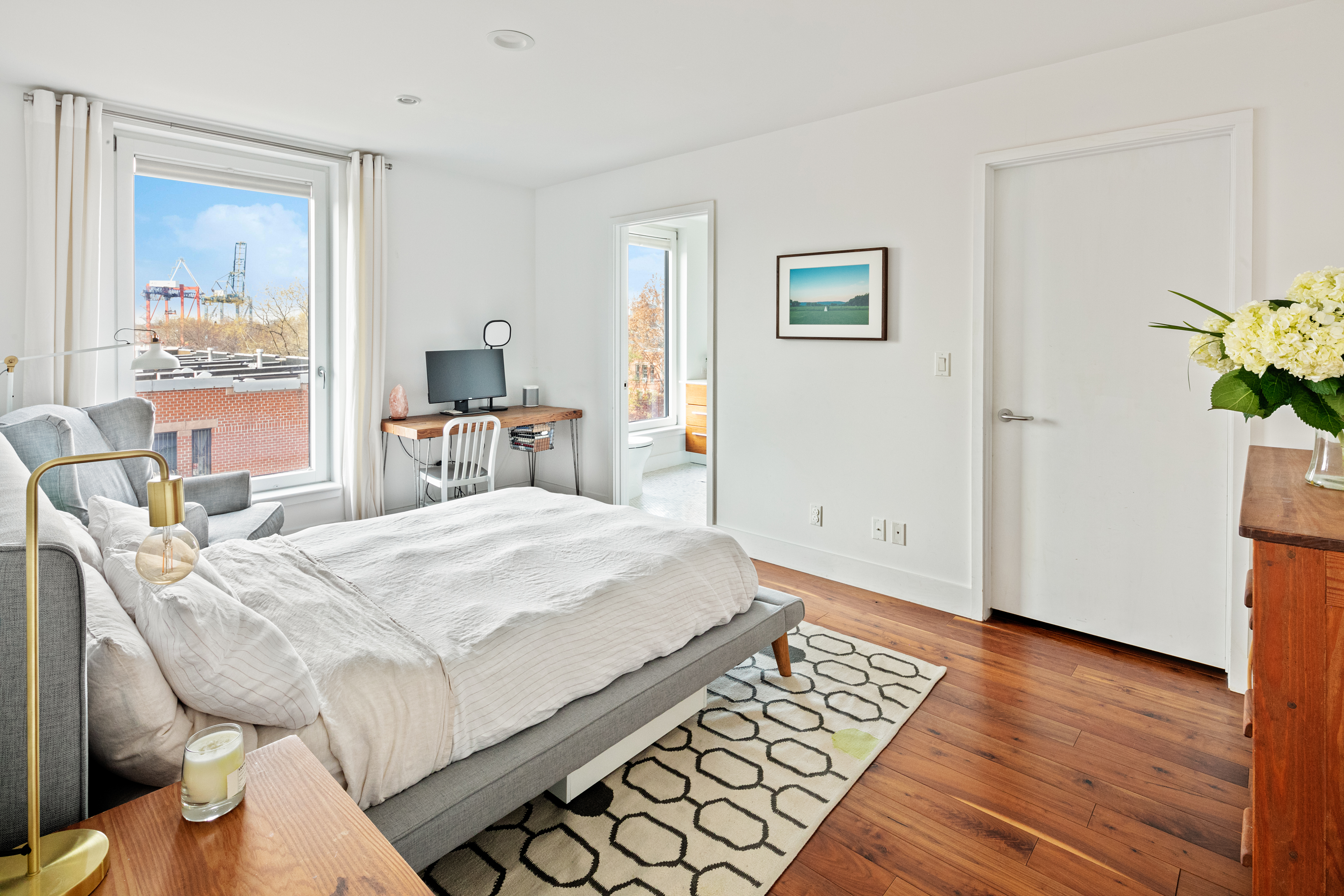 255 Columbia Street, Unit S4 Brooklyn, NY 11231 - Photo 3 of 7 a bed room with a bed and a table