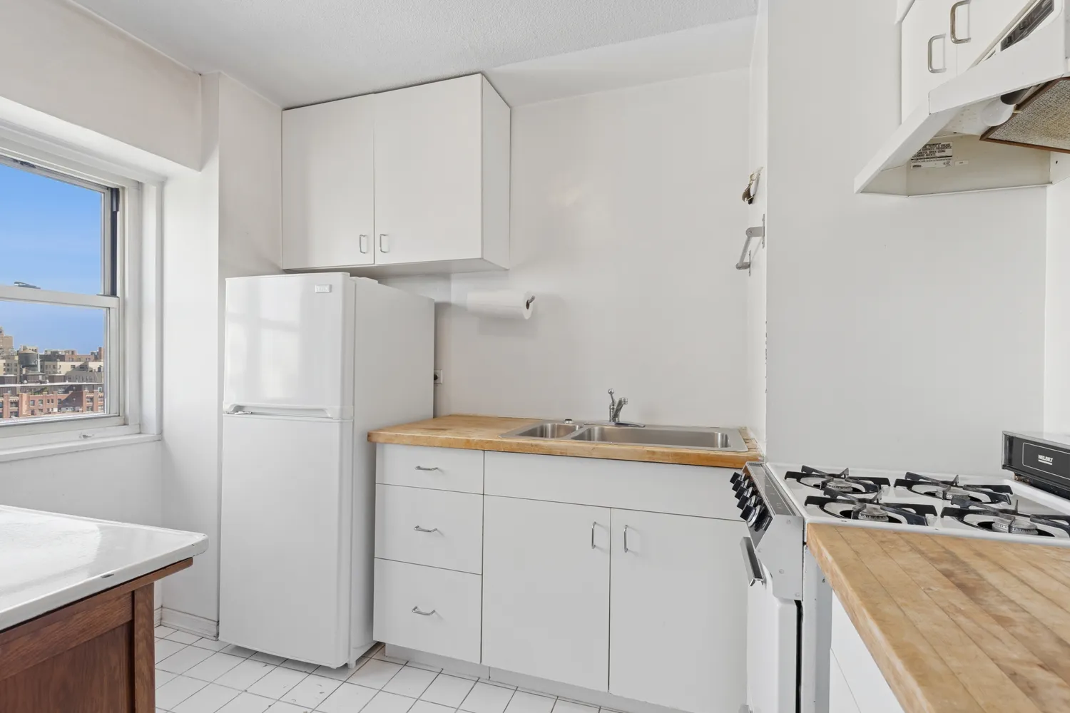 a kitchen with a stove and a refrigerator