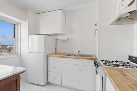 a kitchen with a stove and a refrigerator