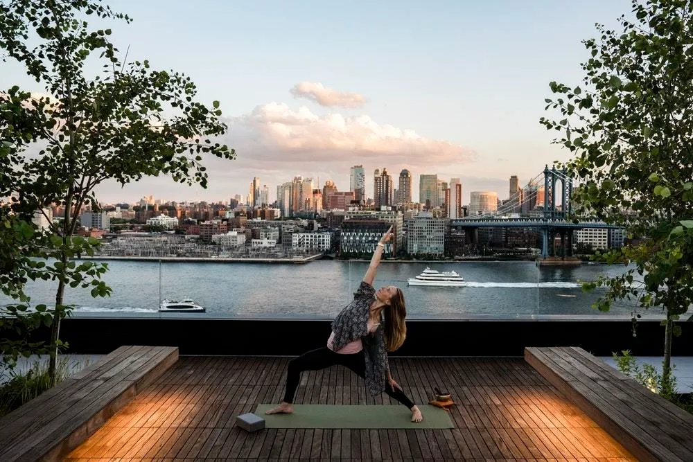 a view of a lake with tall buildings