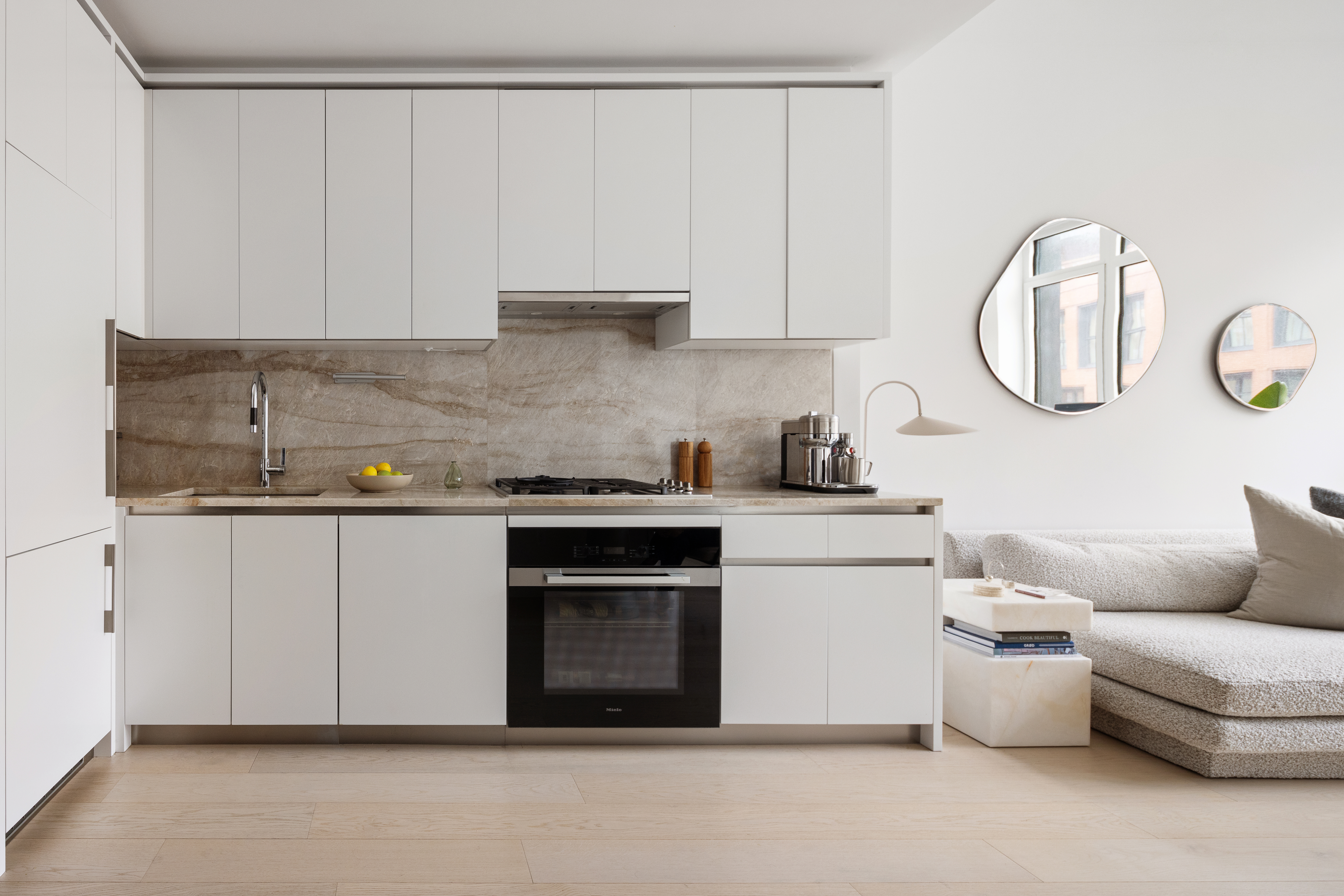 450 Washington Street, Unit 617 Manhattan, NY 10013 - Photo 2 of 6 a kitchen with white cabinets and a stove