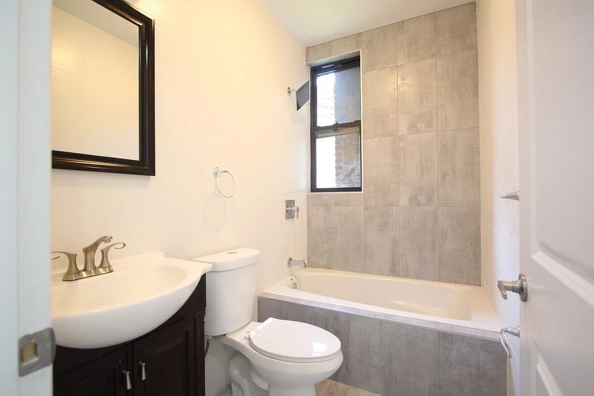 186 Howard Avenue Brooklyn, NY 11233 - Photo 13 of 14 a bathroom with a sink toilet and shower