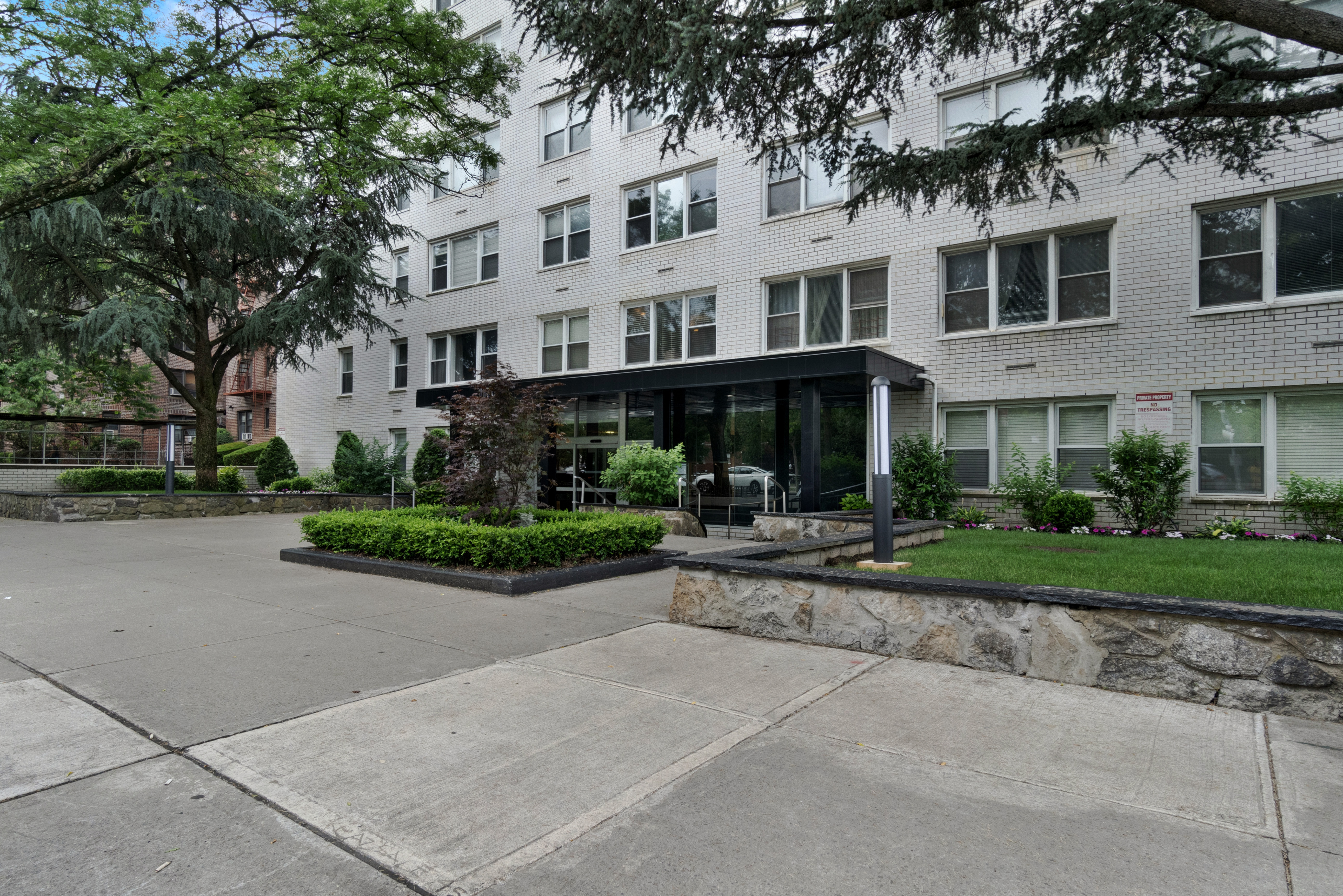 1170 Ocean Parkway, Unit 7A Brooklyn, NY 11230 - Photo 12 of 13 front view of a house with a yard
