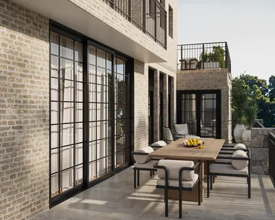 a view of a patio with a table and chairs