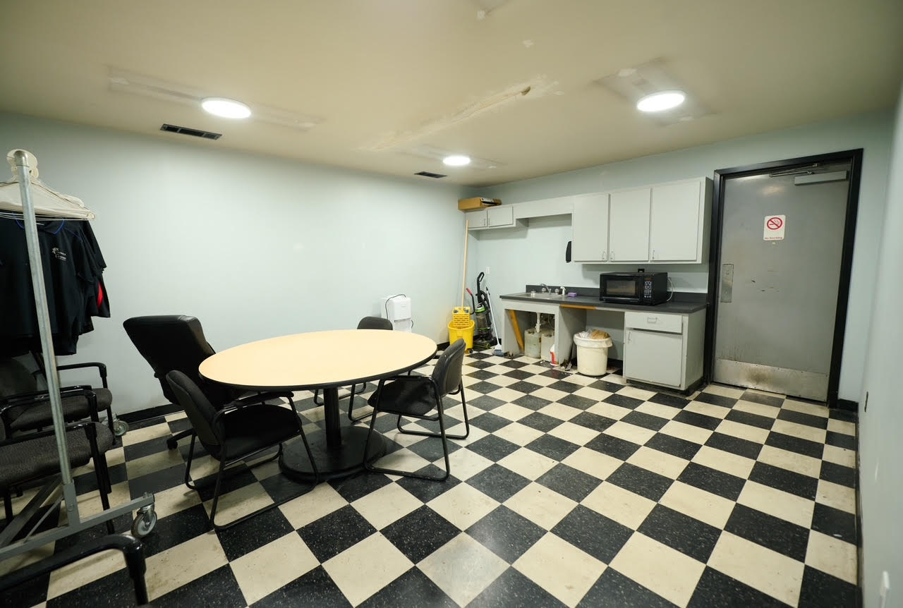 1902 East Central Texas Expressway Killeen, TX 76542 - Photo 47 of 61 a kitchen with a checkered floor and a dining table with chairs