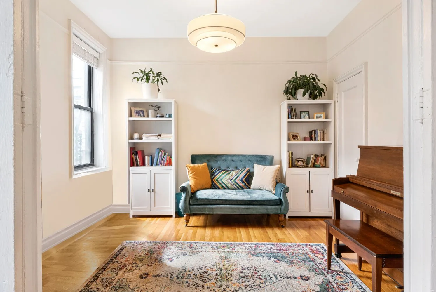 a living room with furniture and a rug