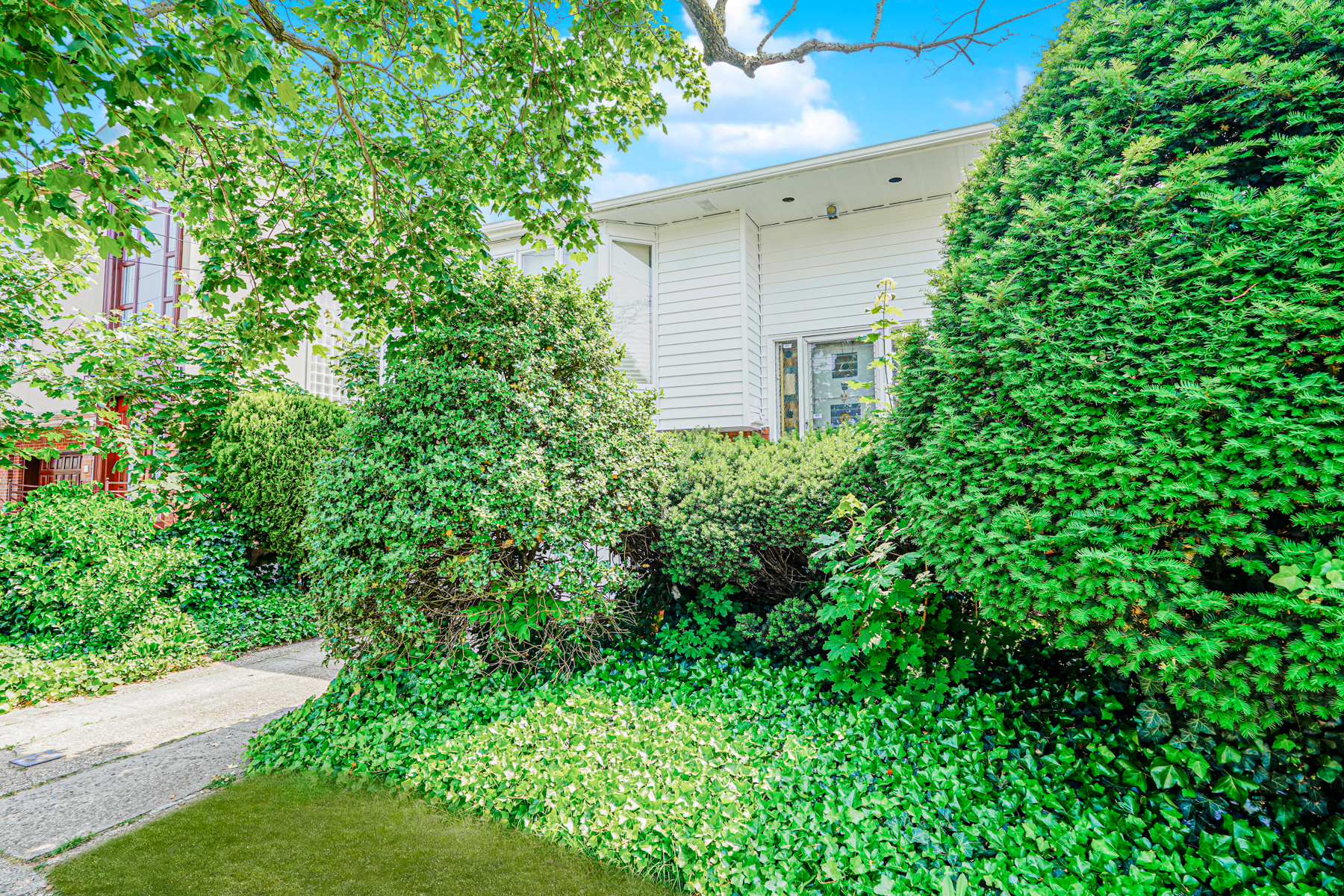 461 Mayfair Drive South Brooklyn, NY 11234 - Photo 27 of 30 a view of a house with a tree
