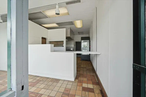 a kitchen with stainless steel appliances a stove and cabinets