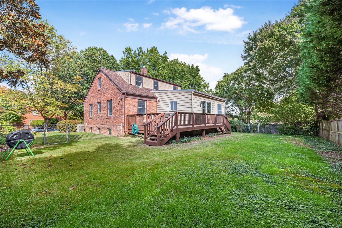 1902 Rookwood Road Silver Spring, MD 20910 - Photo 32 of 36 a view of a house with a big yard and large trees