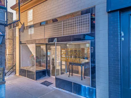 a view of front door with outdoor seating