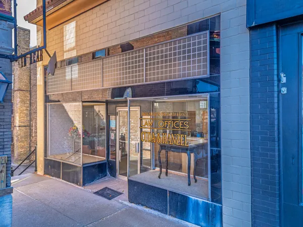 a view of front door with outdoor seating