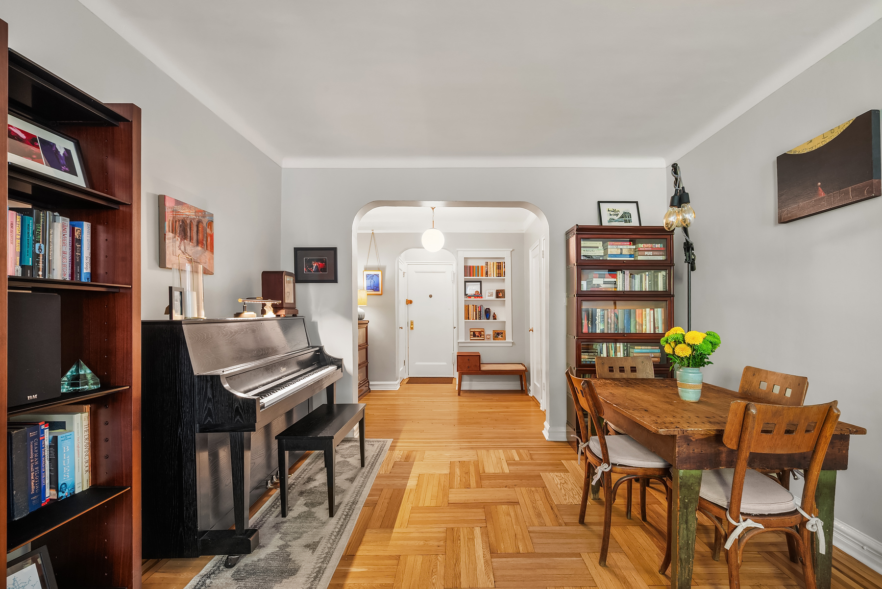 360 Clinton Avenue, Unit 4C Brooklyn, NY 11238 - Photo 2 of 13 a dining room with furniture and a book shelf