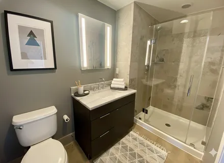 a bathroom with a toilet sink and shower
