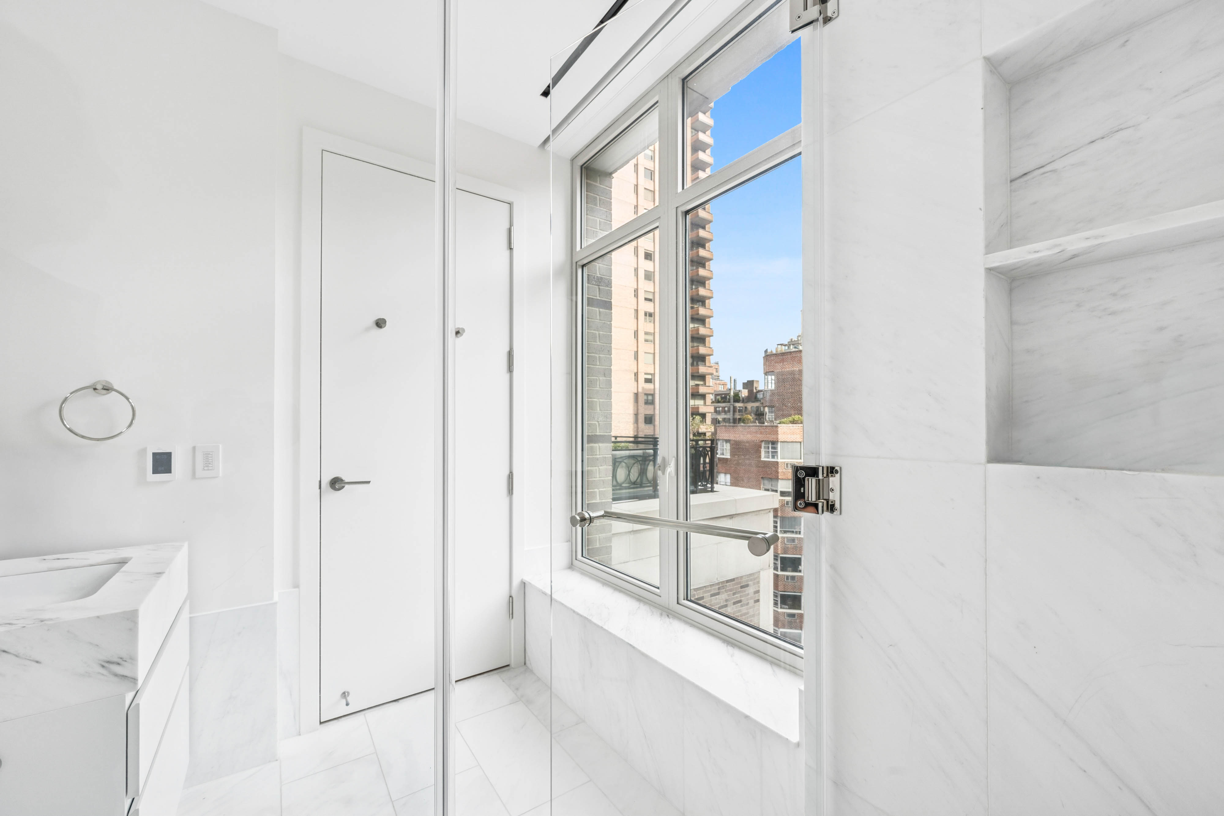 1228 Madison Avenue, Unit 11 Manhattan, NY 10128 - Photo 18 of 22 a view of a balcony a large window and entryway