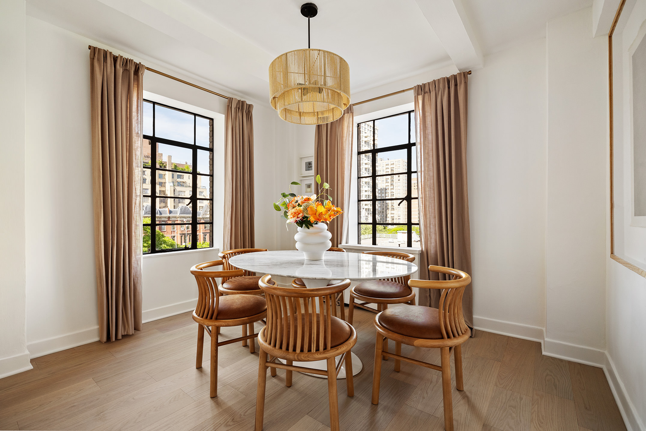 320 Central Park West, Unit 7L Manhattan, NY 10025 - Photo 7 of 16 a dining room with furniture a chandelier and wooden floor