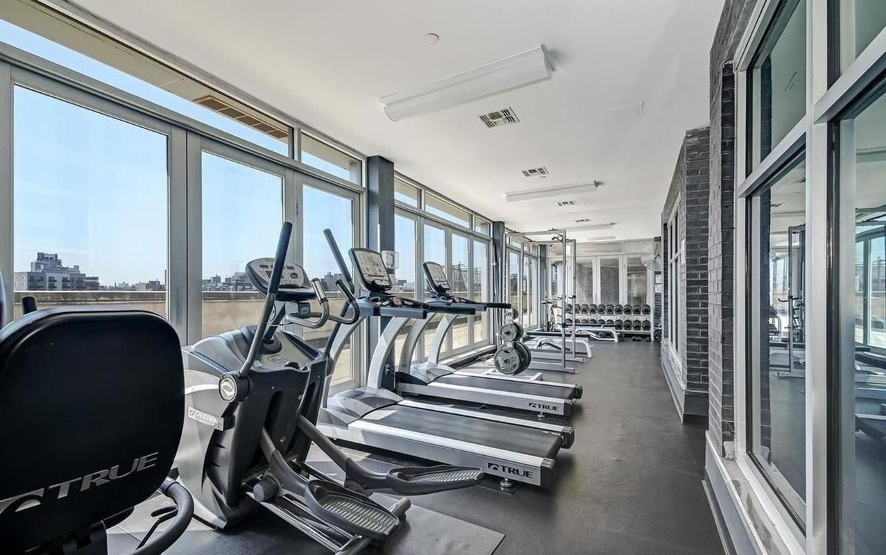 50 Bayard Street, Unit 3J Brooklyn, NY 11211 - Photo 7 of 13 a view of a room with gym equipment