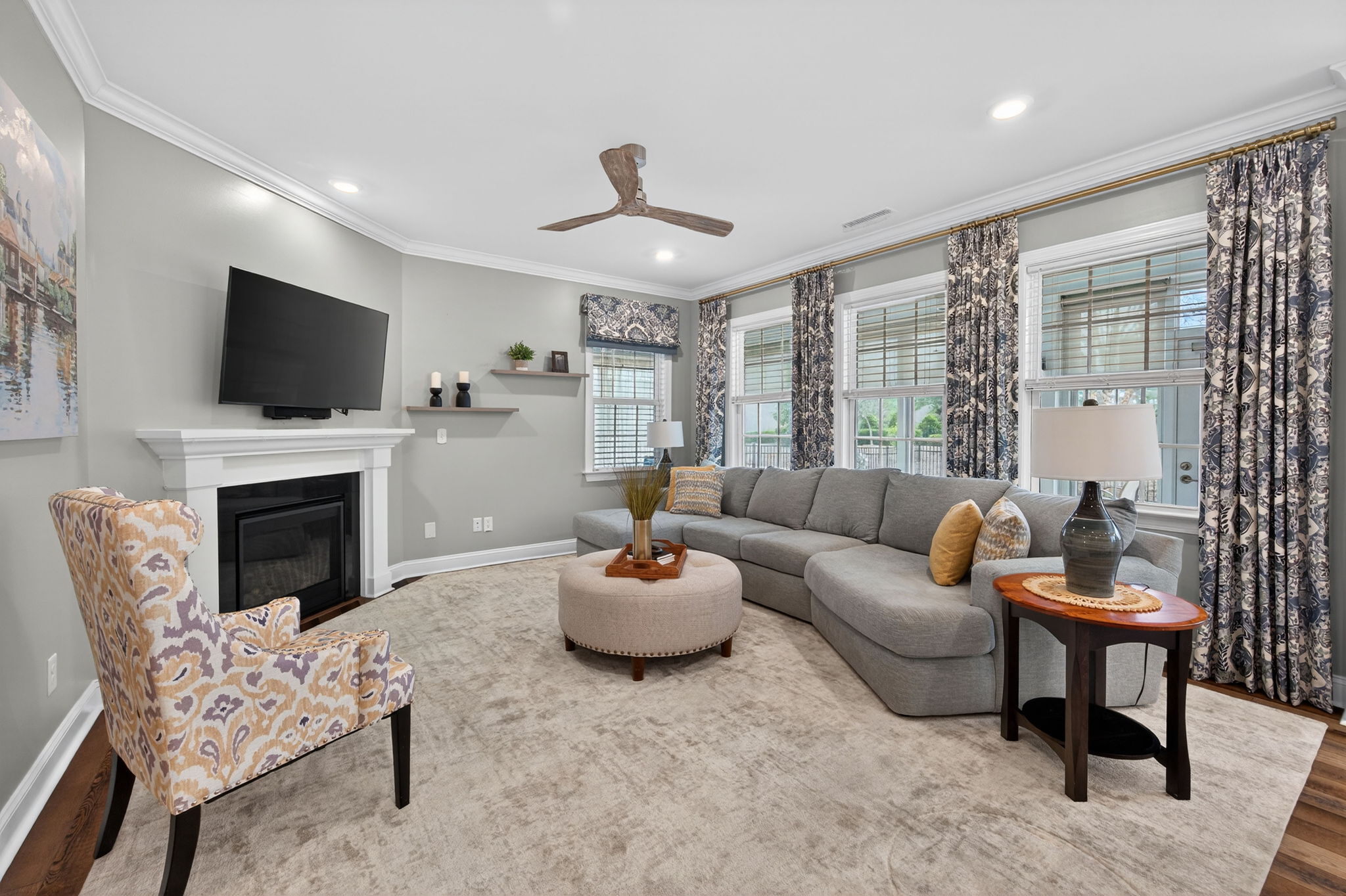 118 Mahogany Run Raleigh, NC 27610 - Photo 13 of 43 a living room with furniture a flat screen tv and a fireplace