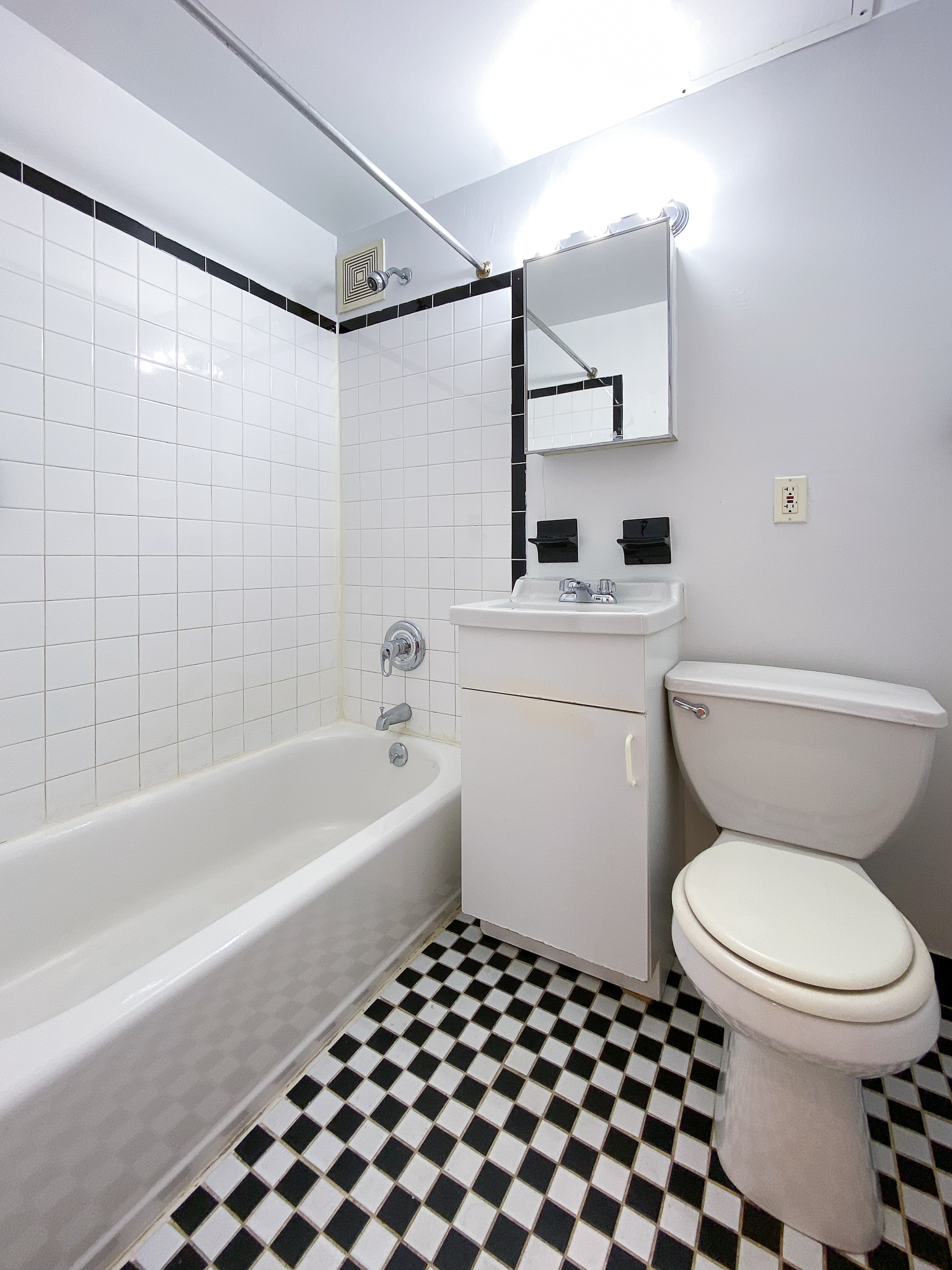 157 East 3rd Street, Unit 2B Manhattan, NY 10009 - Photo 11 of 18 a bathroom with a toilet a sink and a bathtub