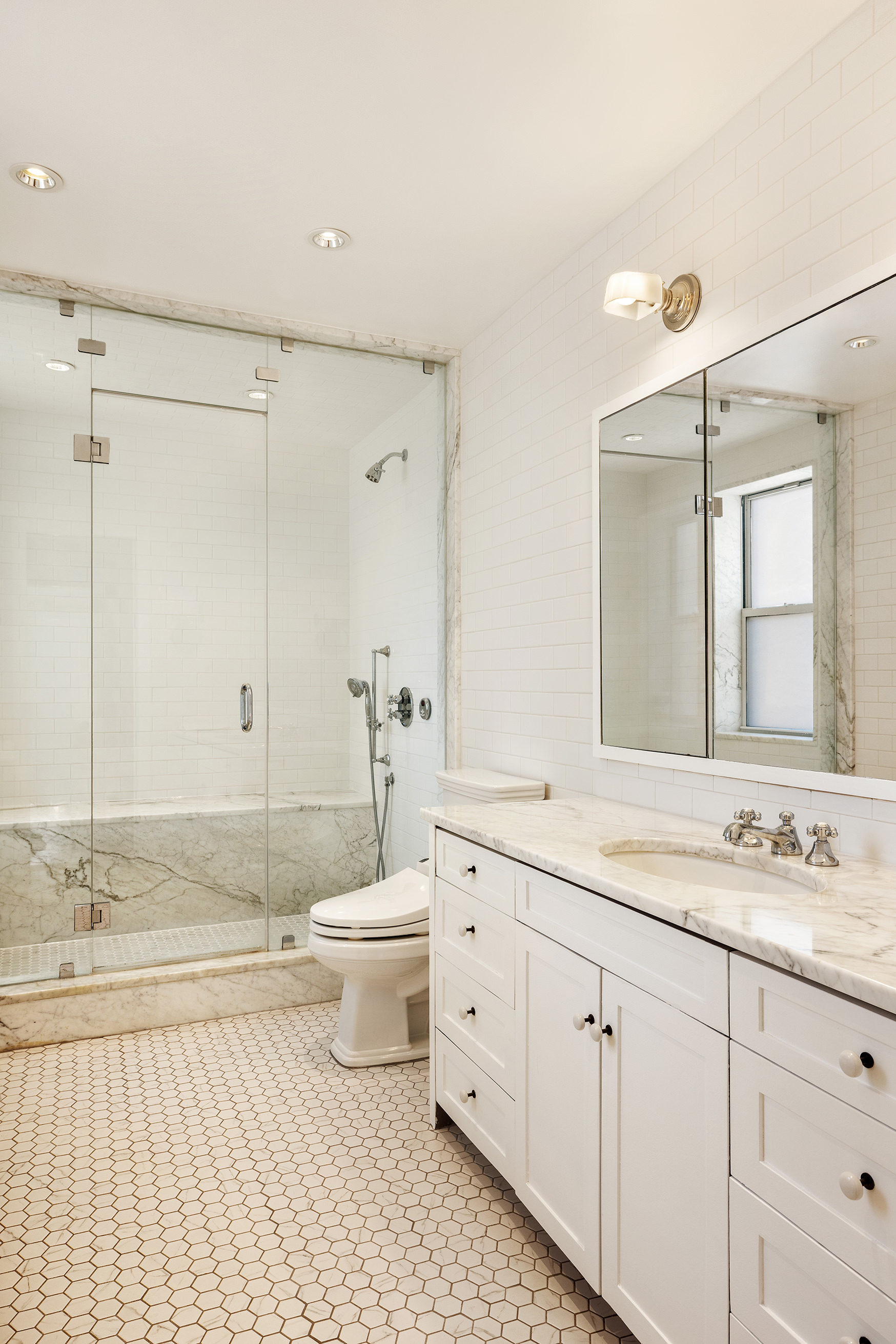338 Metropolitan Avenue Brooklyn, NY 11211 - Photo 9 of 18 a bathroom with a granite countertop sink toilet and shower