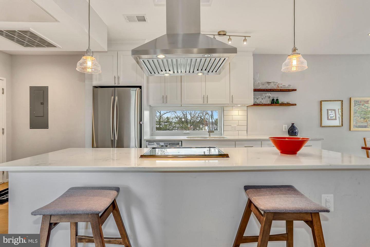 129 Varnum Street Northwest, Unit 6 Washington, DC 20011 - Photo 6 of 25 a kitchen with a table and chairs in it