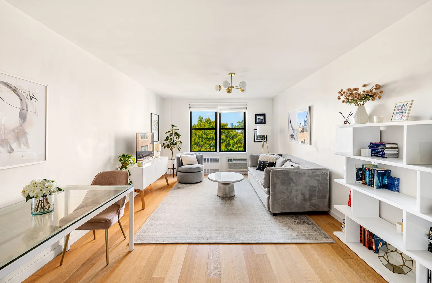 a living room with furniture and a window
