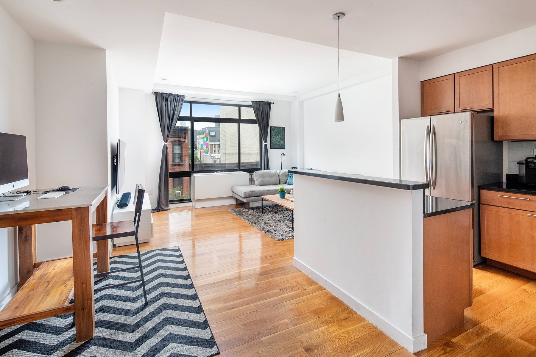 14 Hope Street, Unit 4D Brooklyn, NY 11211 - Photo 2 of 7 a kitchen with counter top space and refrigerator