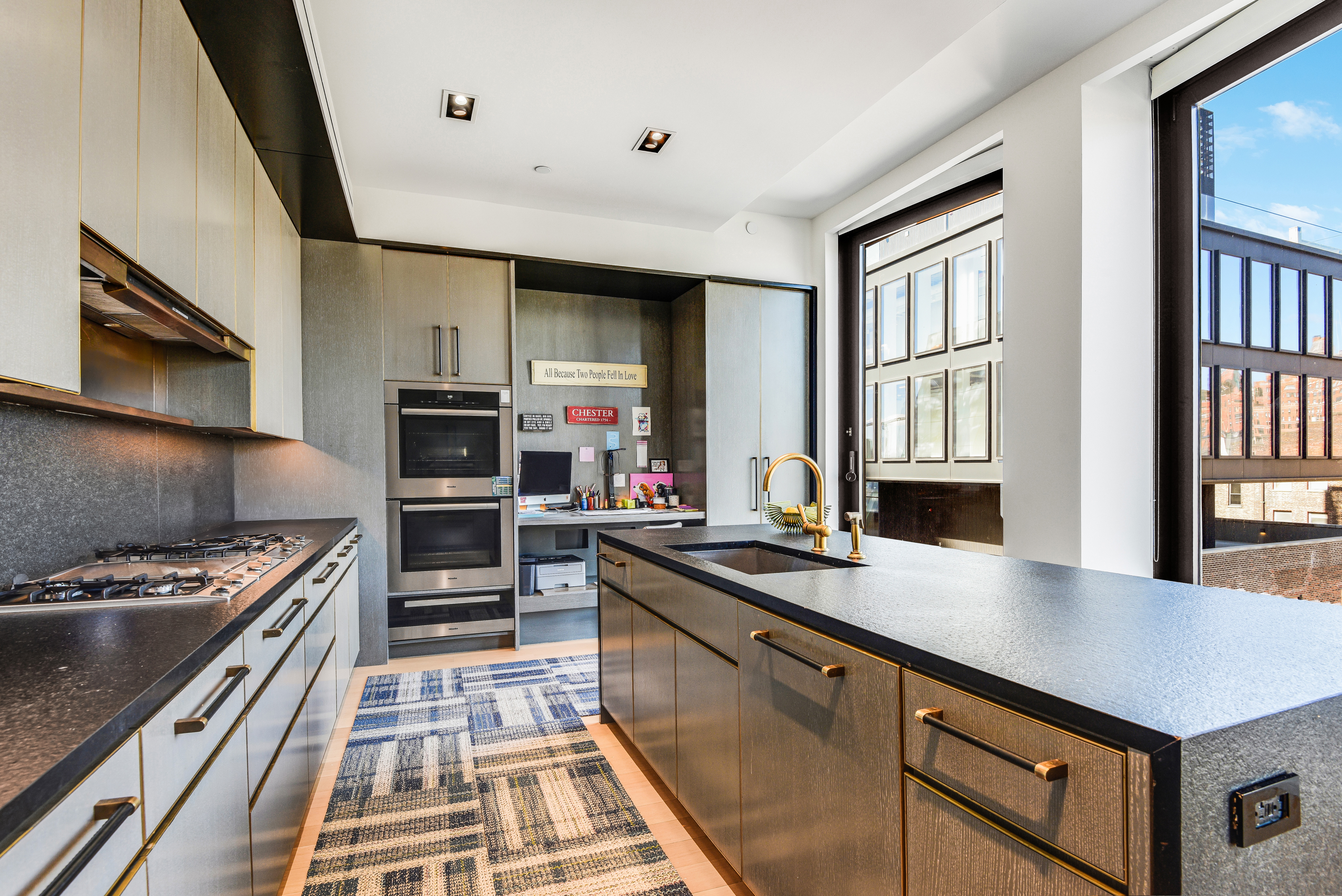 505 West 19th Street, Unit 7W Manhattan, NY 10011 - Photo 9 of 31 a kitchen with stainless steel appliances a stove sink and microwave