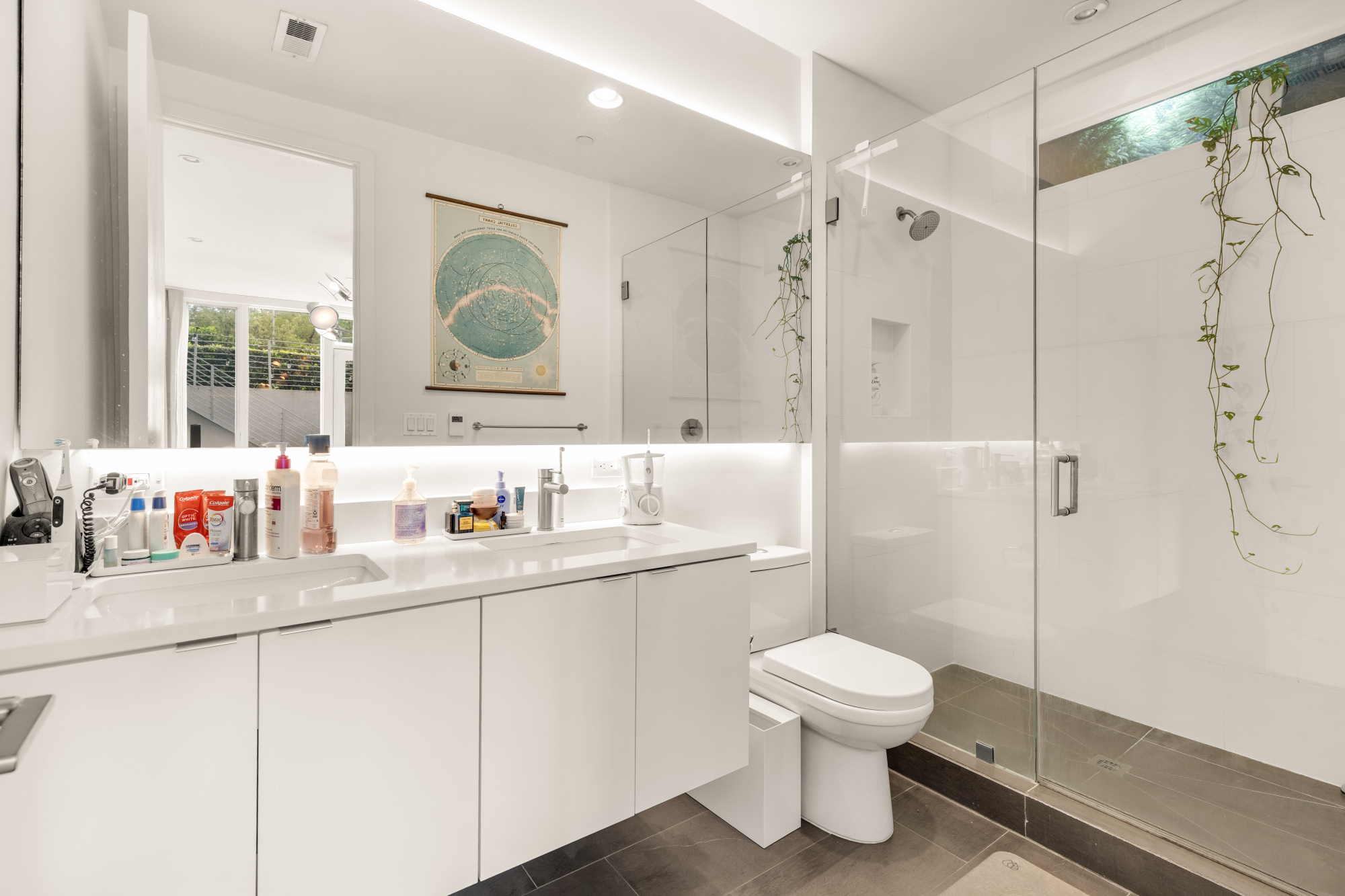 1501 4th Street Northwest, Unit 1 Washington, DC 20001 - Photo 32 of 41 a bathroom with a toilet sink a mirror and shower