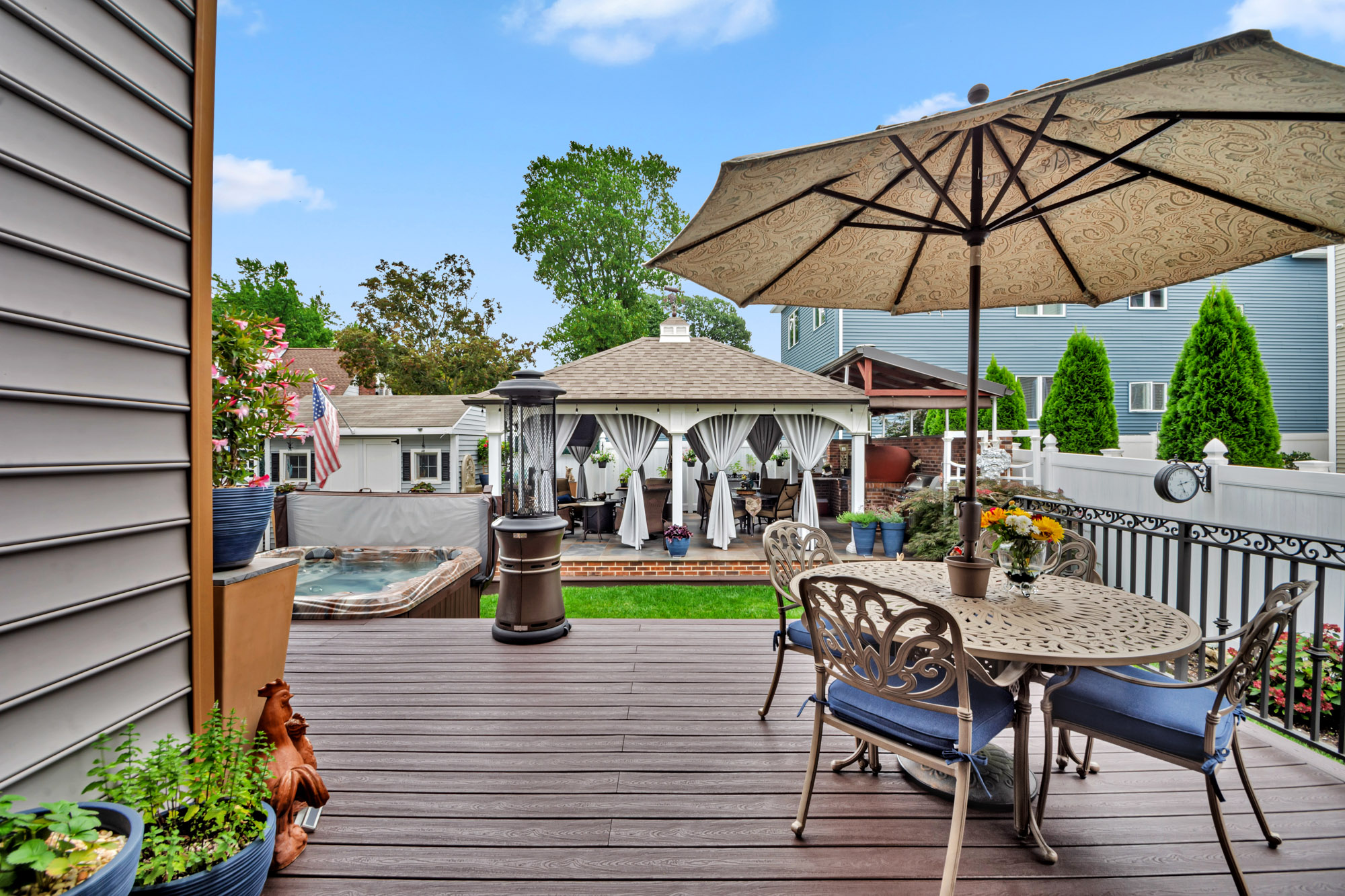 909 Jewett Avenue Staten Island, NY 10314 - Photo 57 of 65 a view of a patio with a table chairs and a umbrella