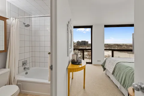 a bathroom with a tub and a shower