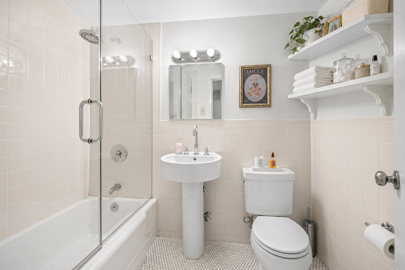 1175 York Avenue, Unit 1K Manhattan, NY 10065 - Photo 7 of 10 a bathroom with a sink toilet and shower