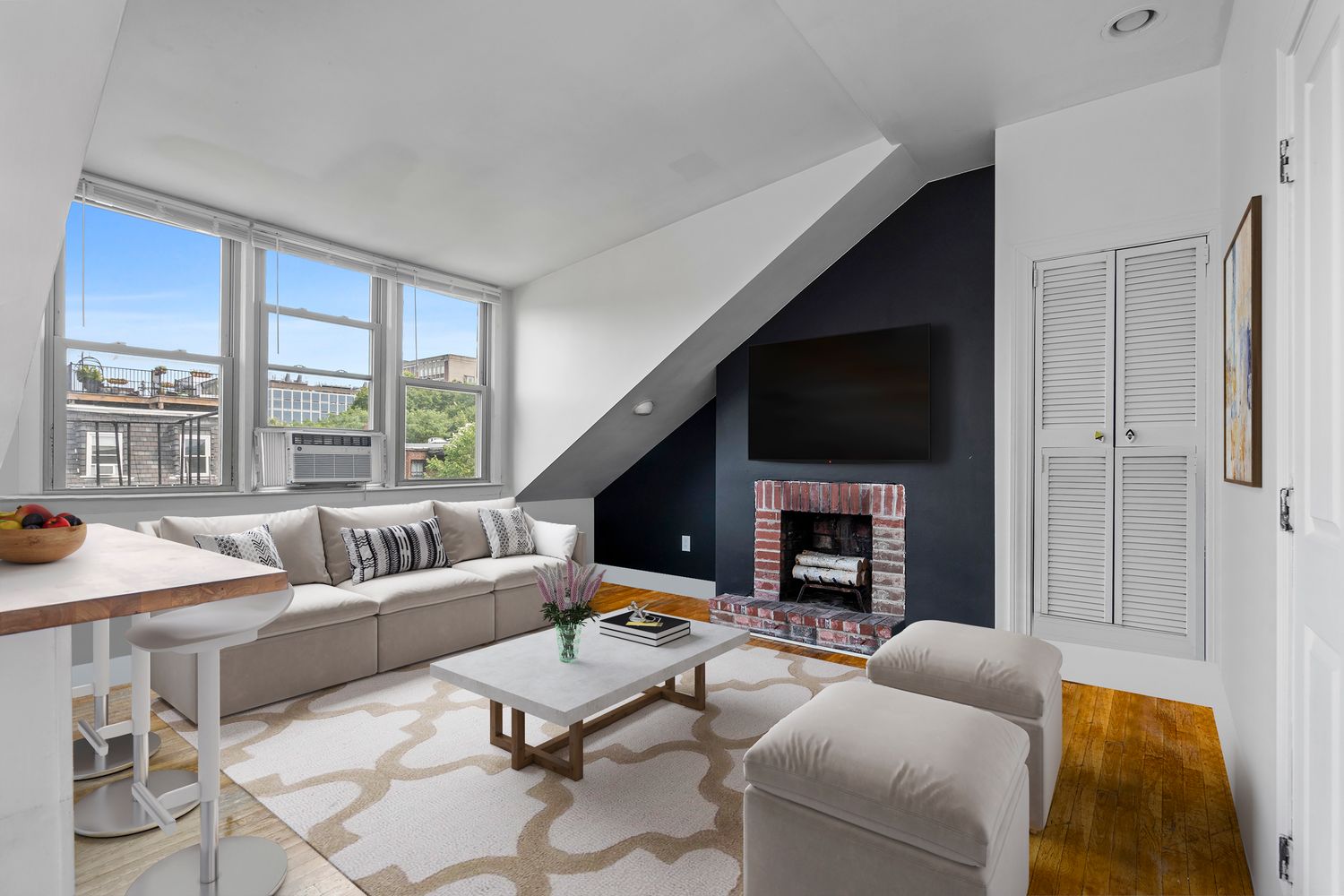 a living room with fireplace furniture and a flat screen tv