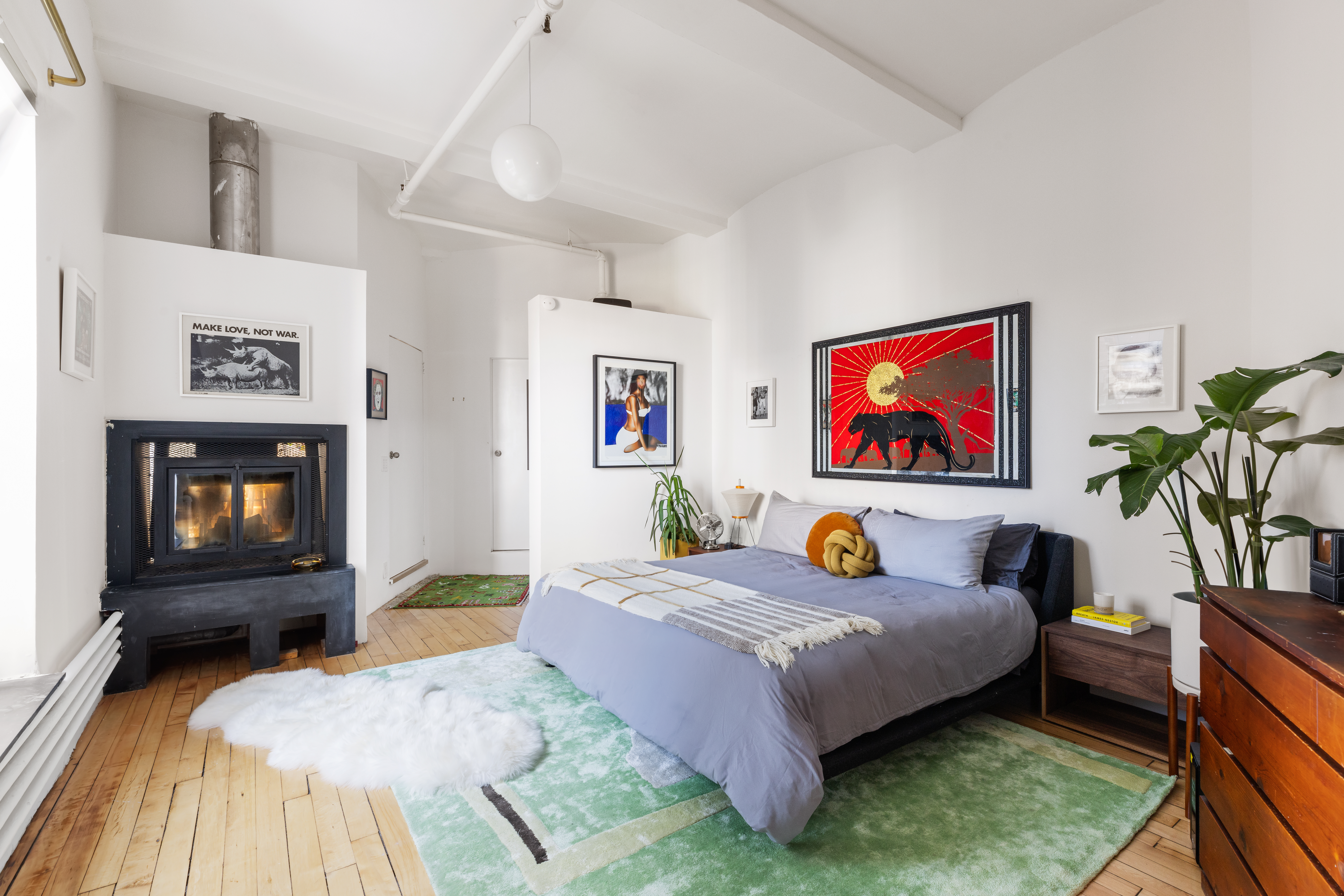 59 4th Avenue, Unit 8A Manhattan, NY 10003 - Photo 8 of 12 a bedroom with a bed and a couch