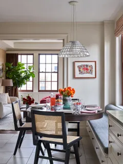 a room with a table and chairs in it