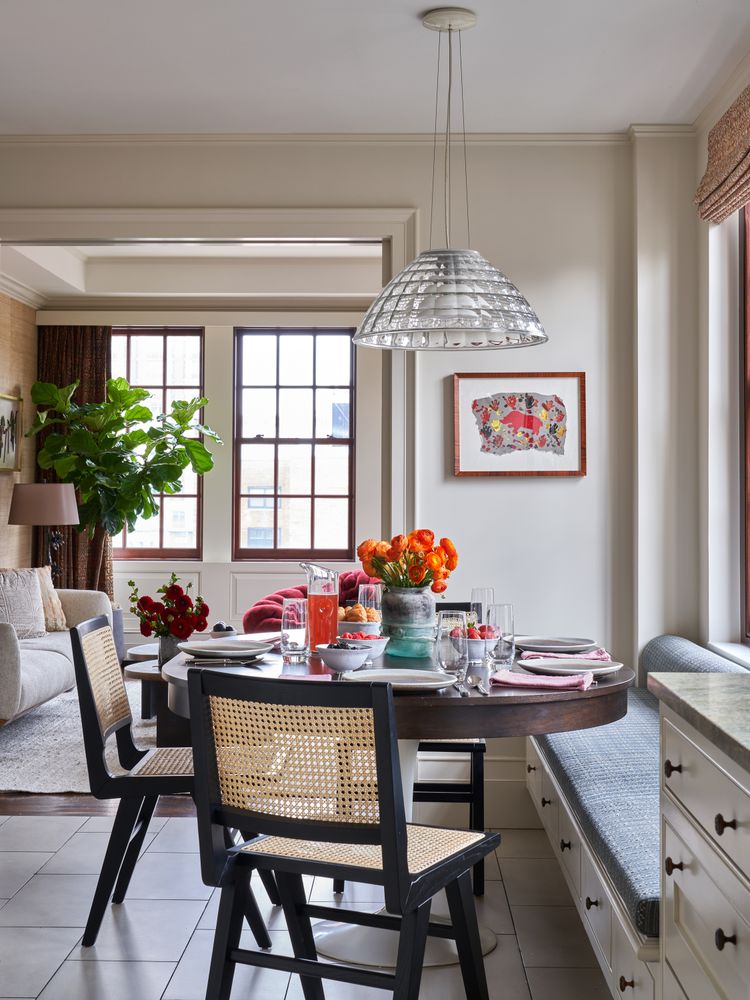 a room with a table and chairs in it