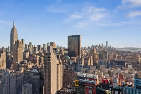 a kitchen with stainless steel appliances granite countertop a lot of counter space and wooden floors