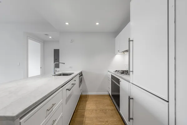 a kitchen with a stove and a sink