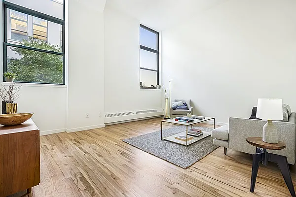 a living room with a couch and a window