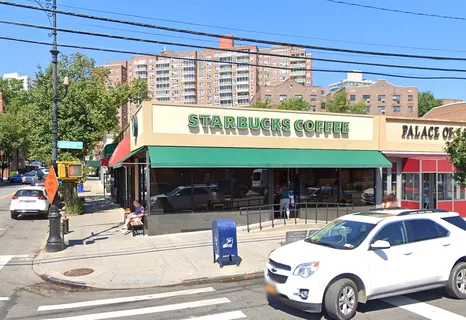 a front view of building with parking