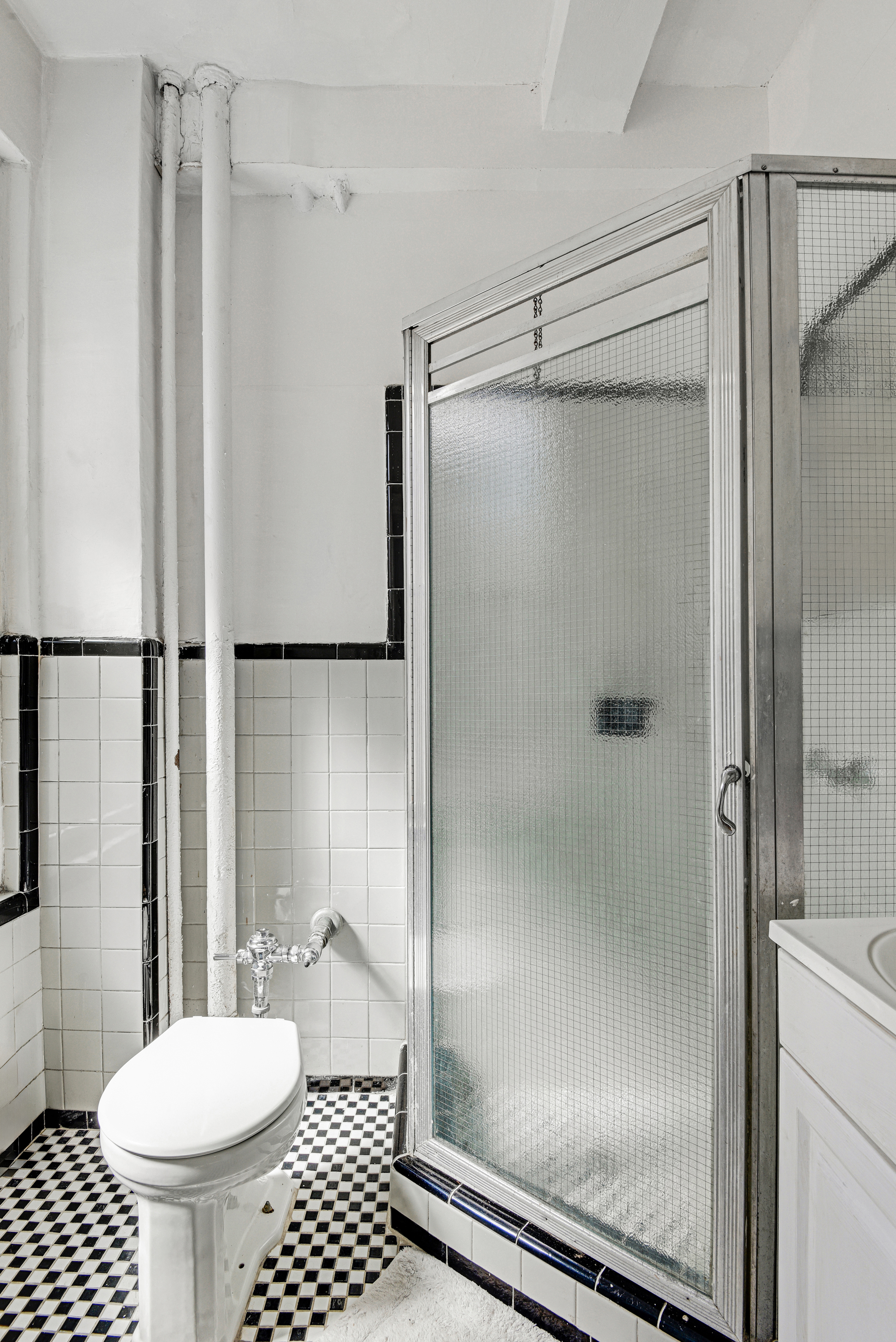 416 Ocean Avenue, Unit 14 Brooklyn, NY 11226 - Photo 13 of 21 a bathroom with a shower toilet and sink