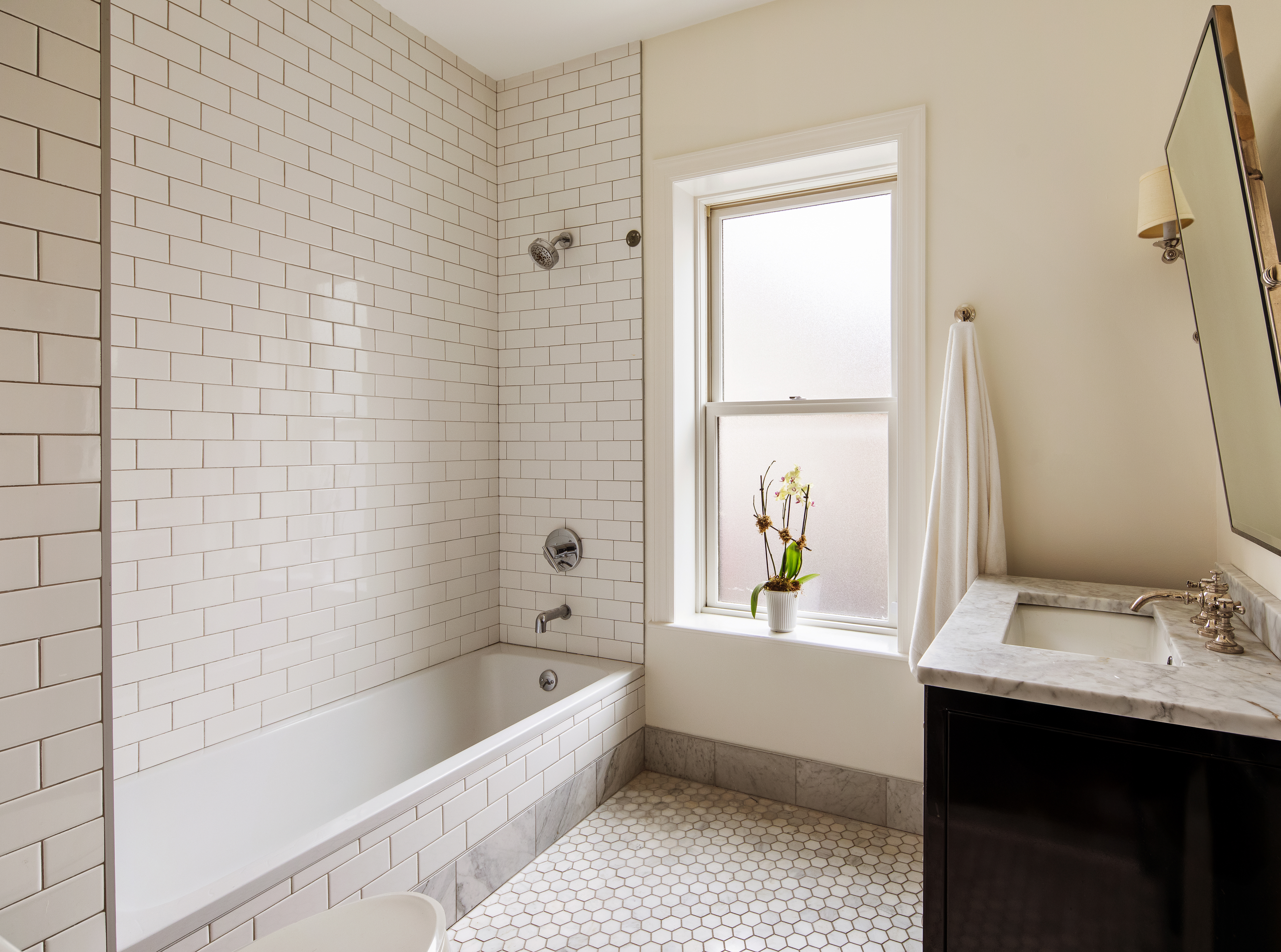 27 7th Avenue Brooklyn, NY 11217 - Photo 20 of 23 a bathroom with a tub sink and a bathtub