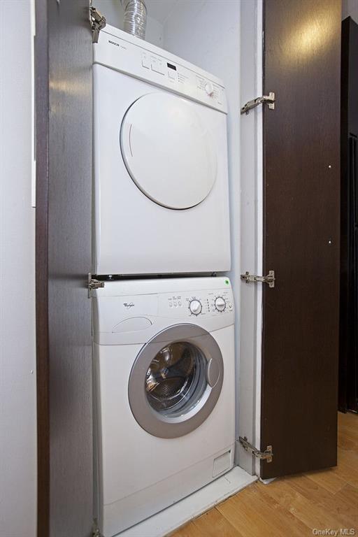 13-11 Jackson Avenue, Unit 4C Queens, NY 11101 - Photo 6 of 7 a utility room with dryer and washer