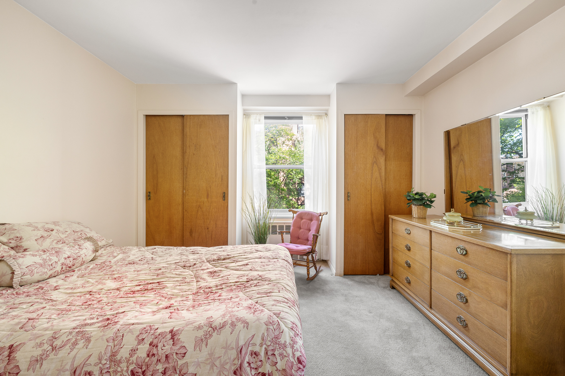 35-51 85th Street, Unit 4E Queens, NY 11372 - Photo 9 of 14 a bedroom with a bed and a dresser