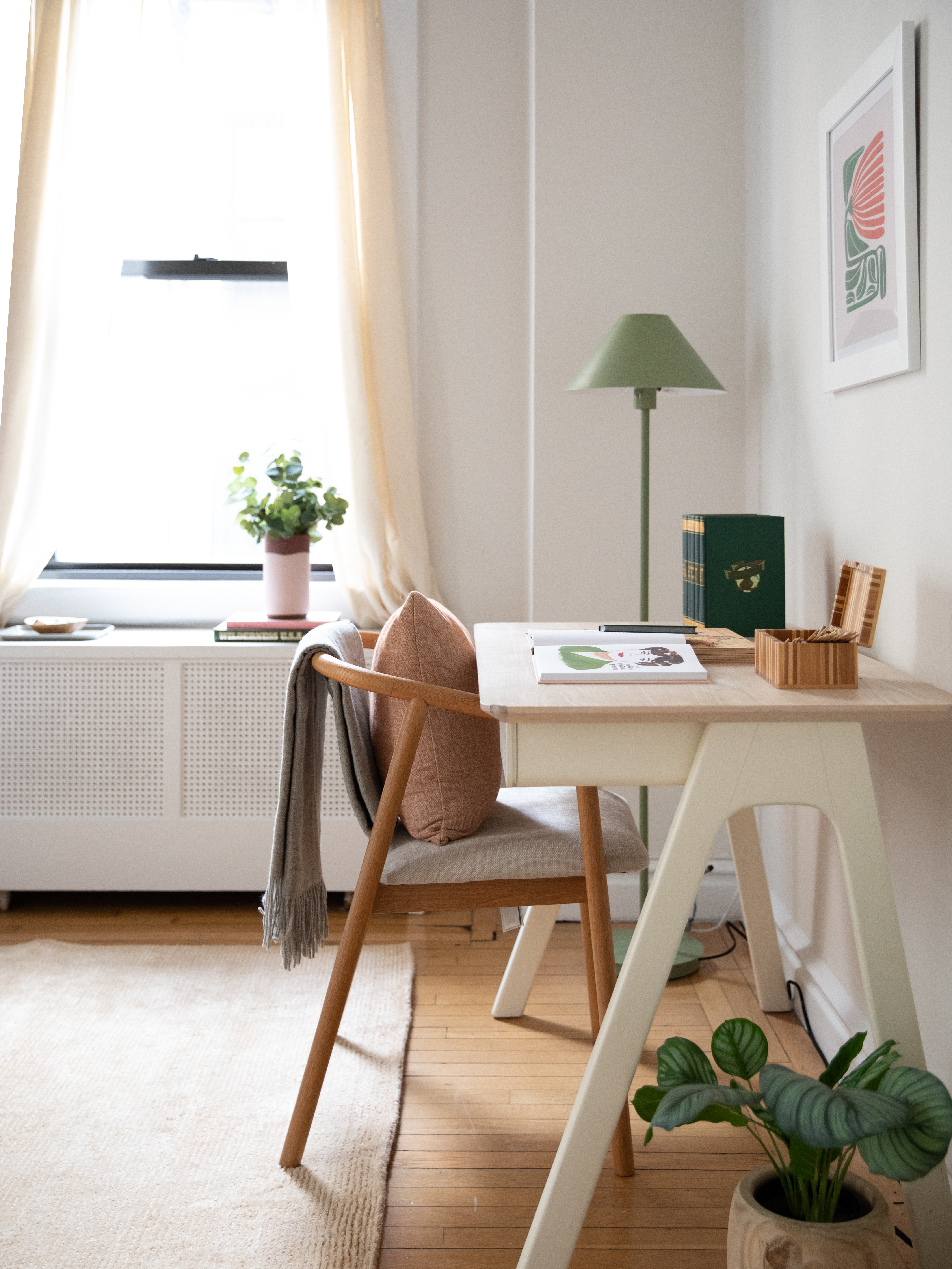 115 East 90th Street, Unit 4E Manhattan, NY 10128 - Photo 7 of 9 a dining room with furniture and a potted plant
