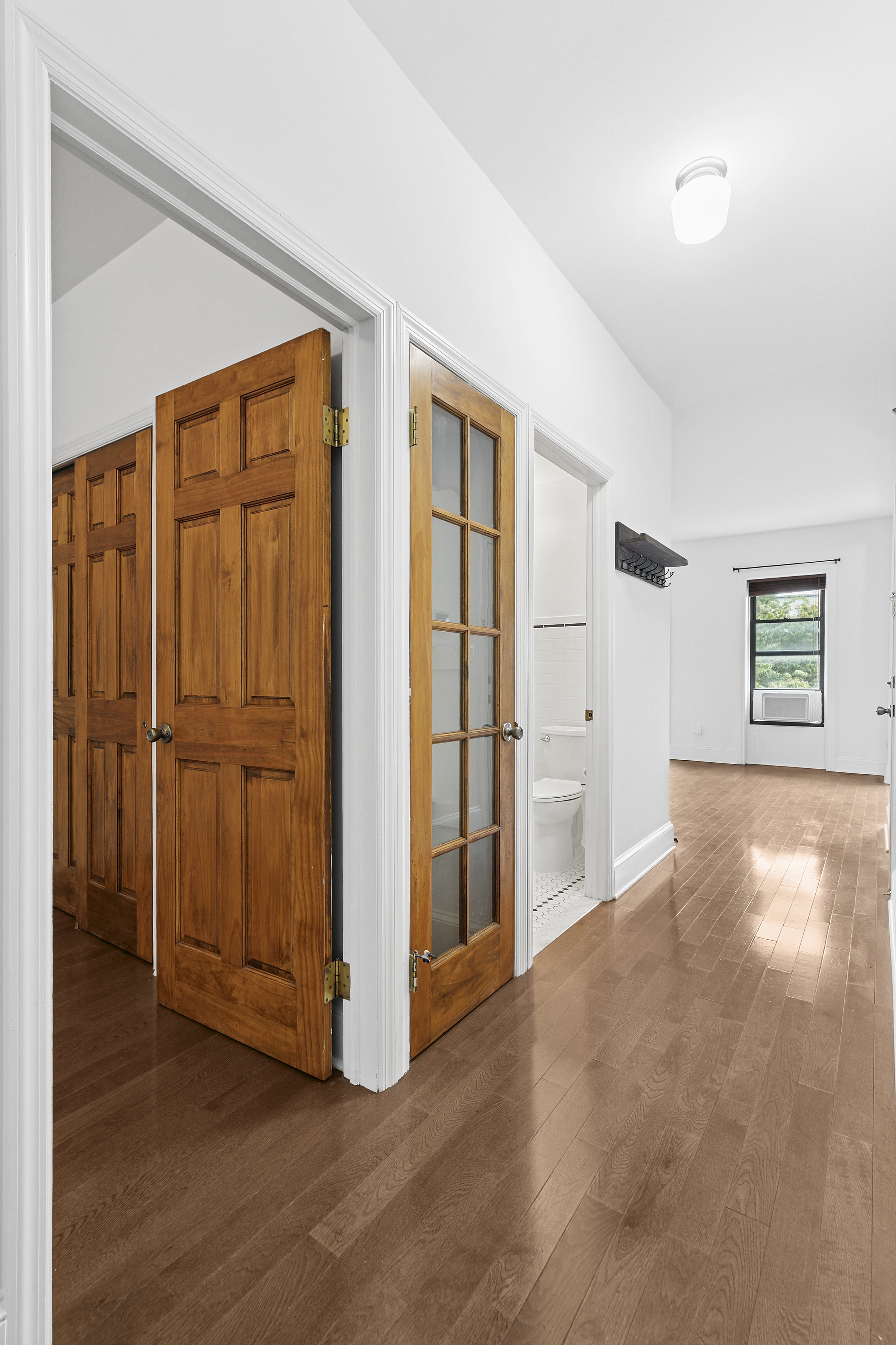 68 Downing Street, Unit 2 Brooklyn, NY 11238 - Photo 5 of 8 a view of empty room with wooden floor and cabinet