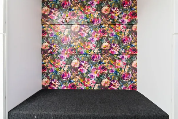 a living room with furniture kitchen view and a window