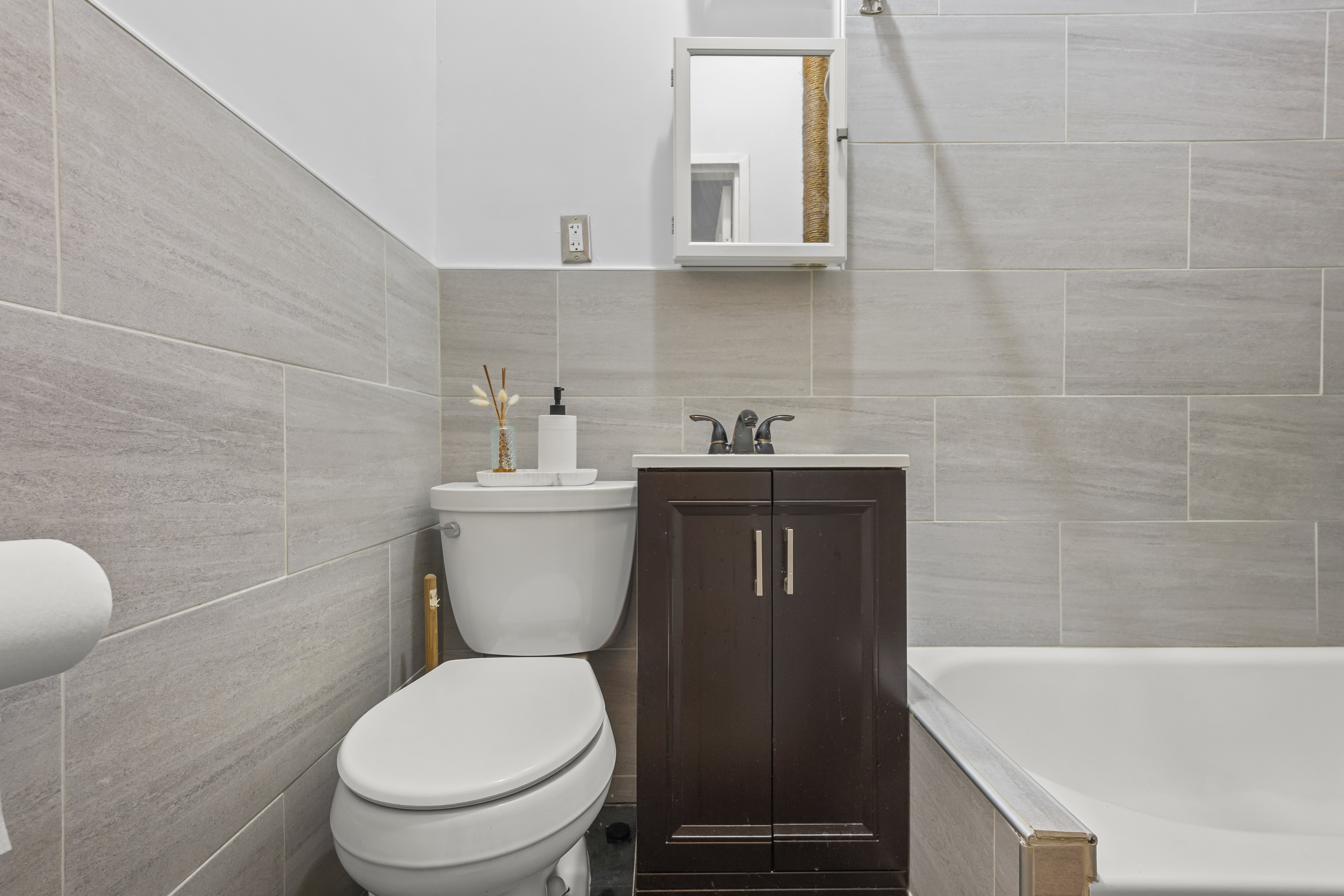 1777 Madison Avenue, Unit 24 Manhattan, NY 10035 - Photo 11 of 20 a bathroom with a toilet a sink and bathtub