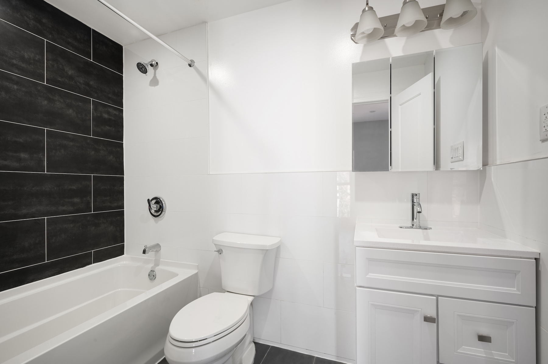307 West 136th Street Manhattan, NY 10030 - Photo 14 of 26 a bathroom with a toilet a sink and bathtub