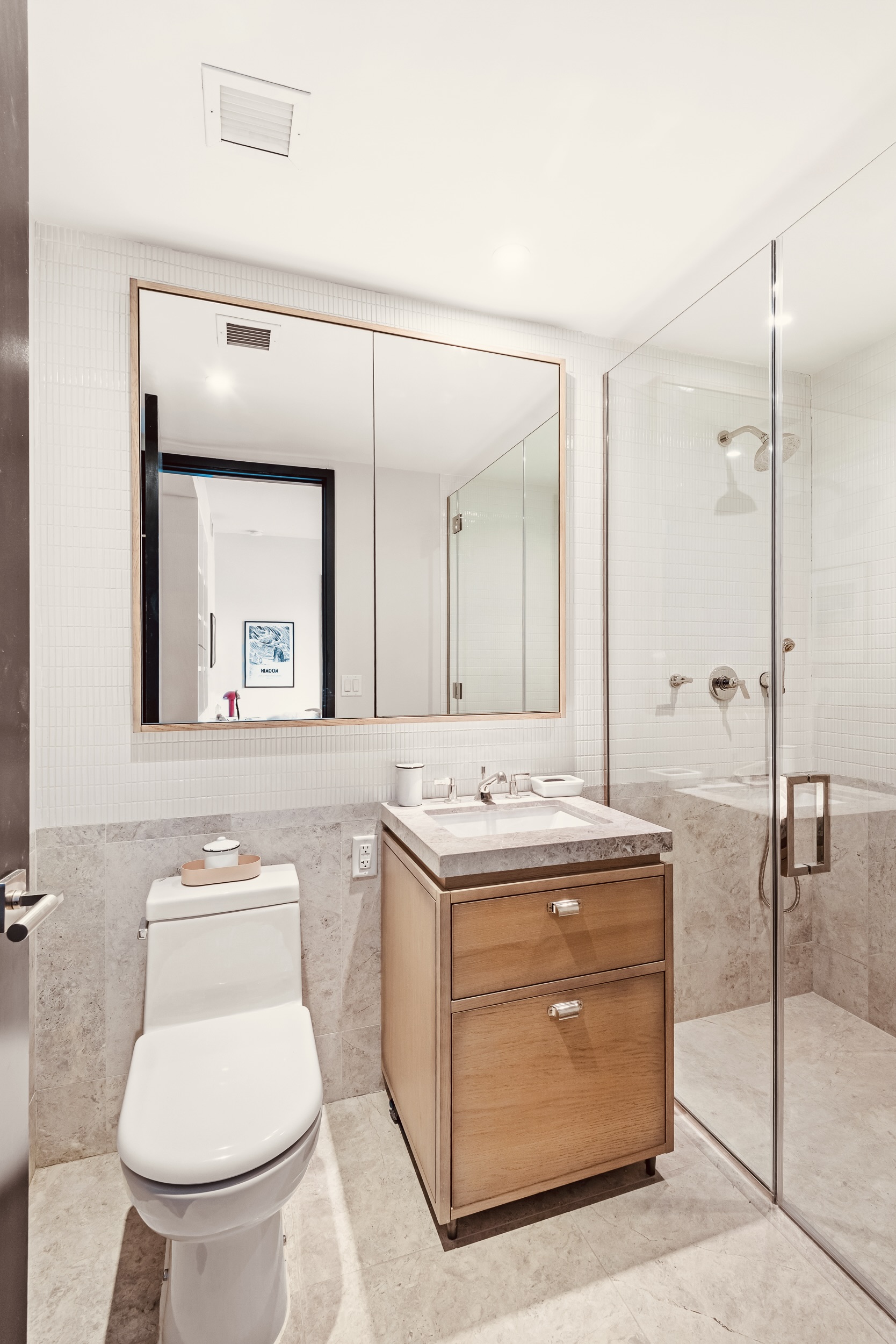 51 Jay Street, Unit 5J Brooklyn, NY 11201 - Photo 10 of 15 a bathroom with a toilet a sink and mirror